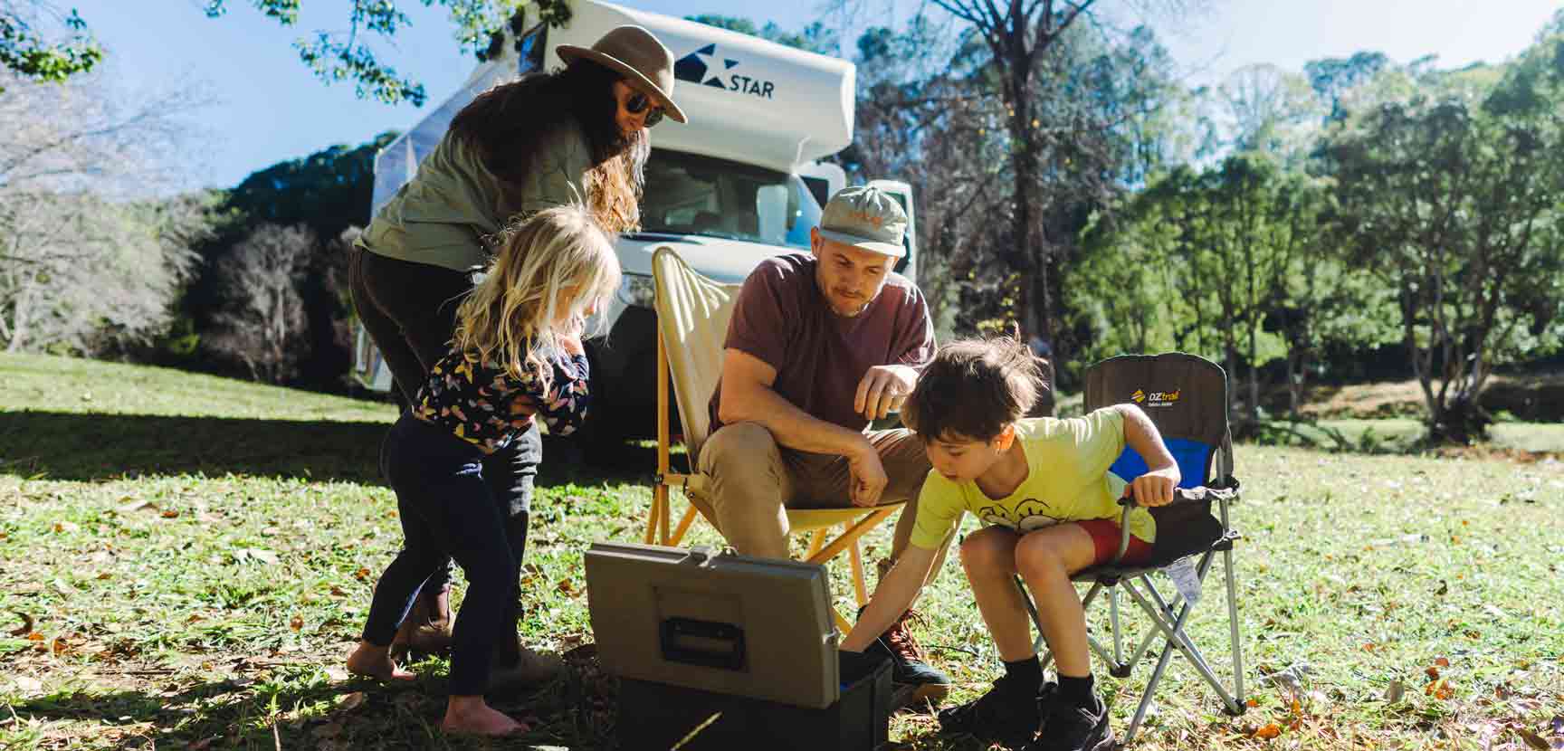Family looking in fishing tackle box