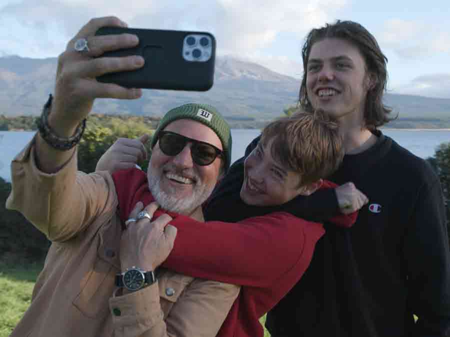Father taking selfie with sons at Lake Rotorua