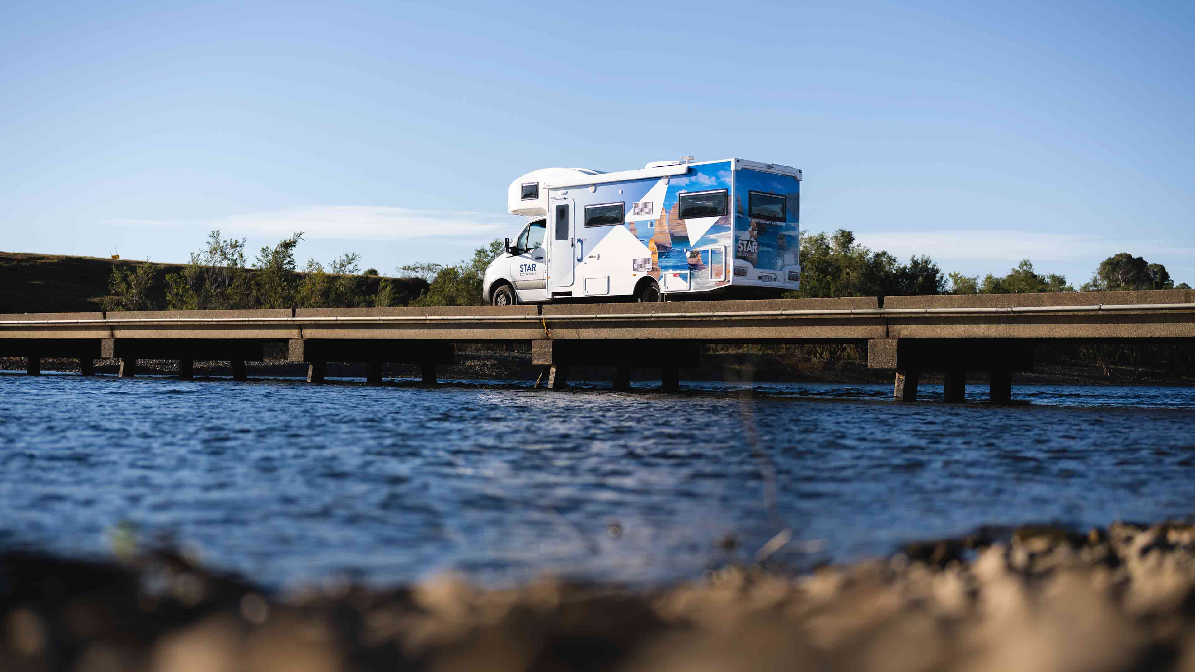 Star RV motorhome driving over causeway